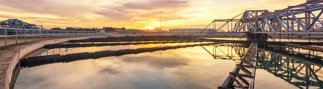 An image of a water plant at sunrise, gearing up to work on phosphorus removal from wastewater.