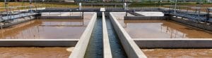 An image of a water plant at sunrise, gearing up to work on phosphorus removal from wastewater.